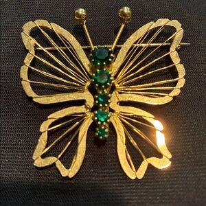 Elegant Gold Tone Butterfly Brooch with Green Accents